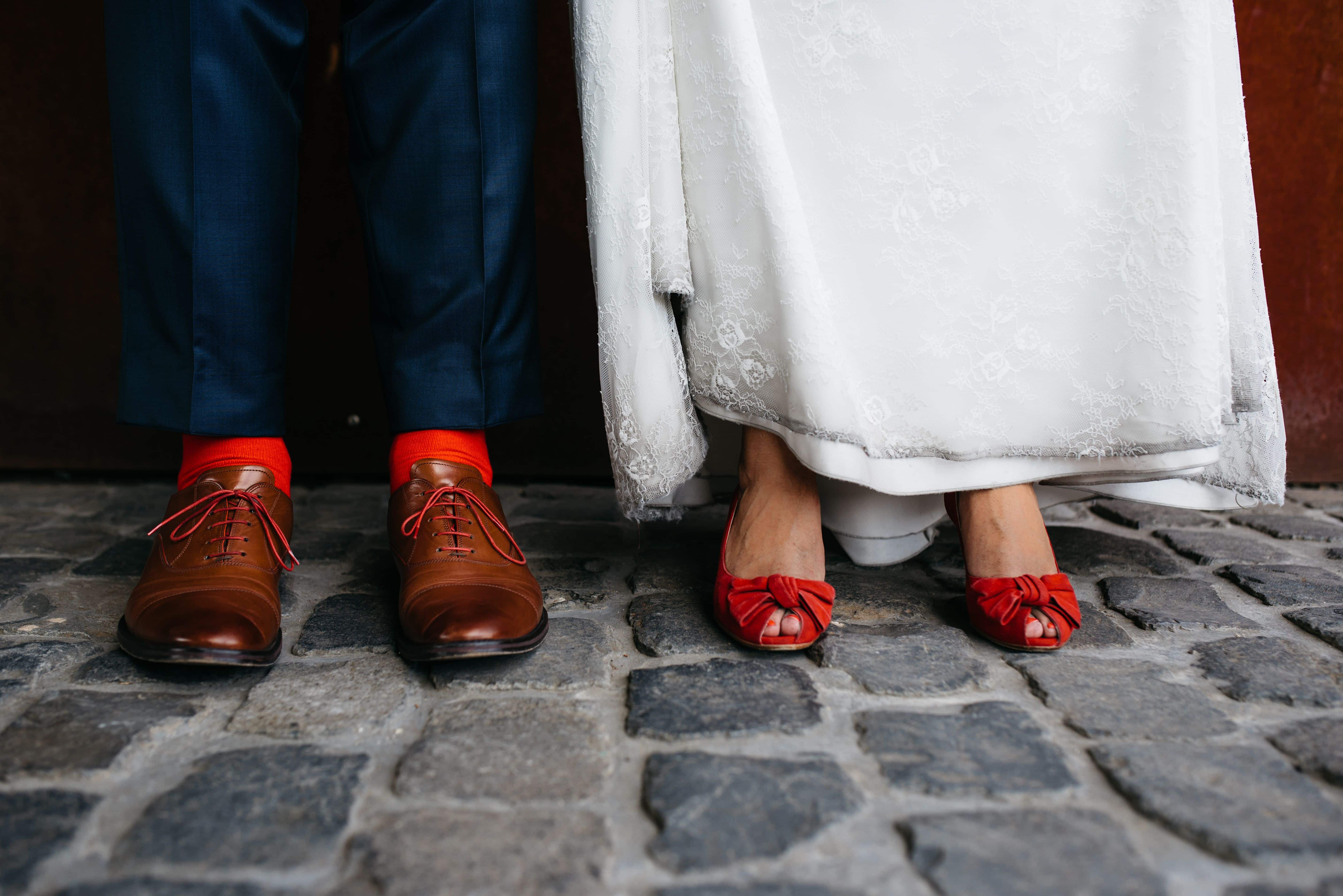 A bride's red shoes on her wedding day