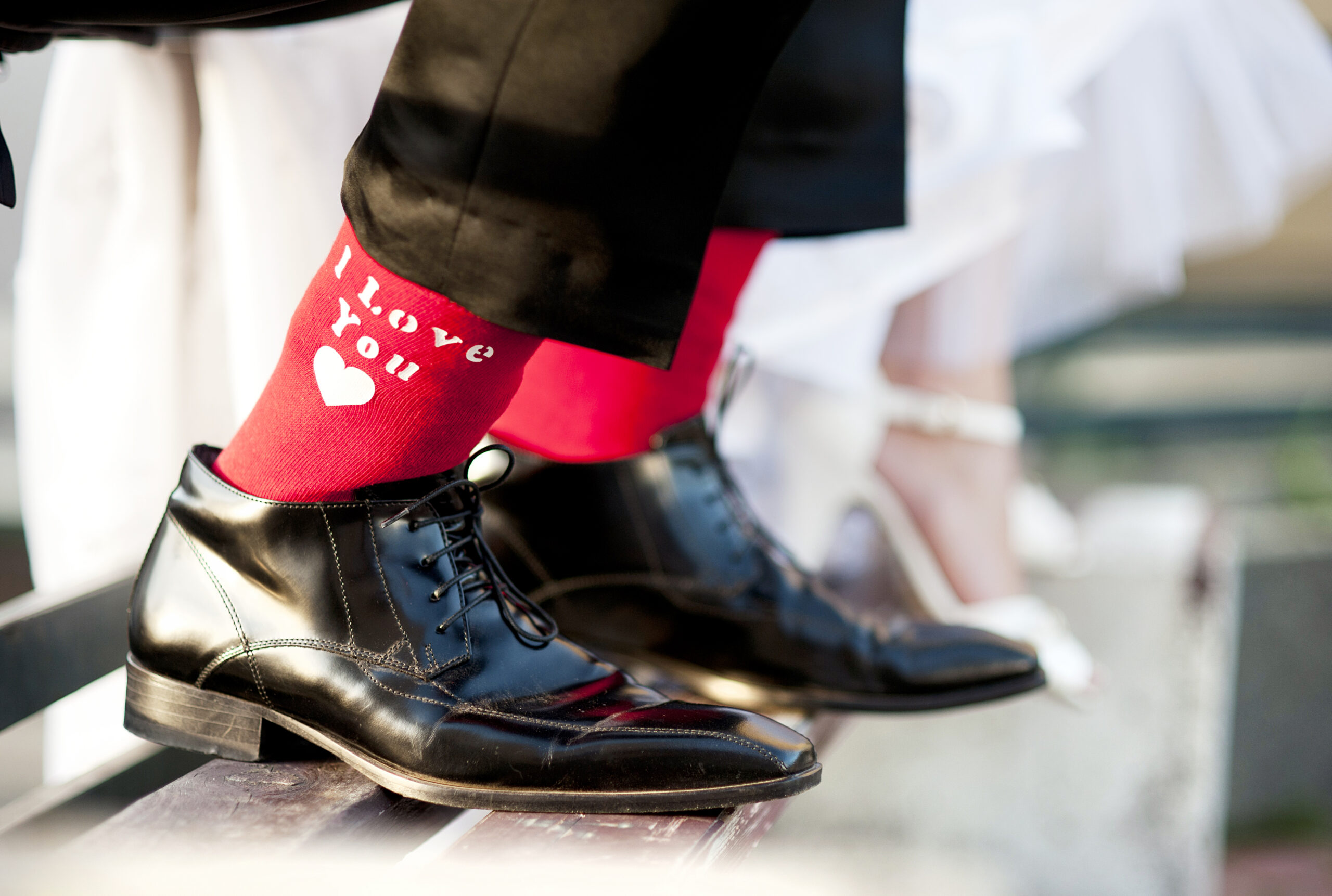 Wedding shoes — groom's black shoes and bride's white heels
