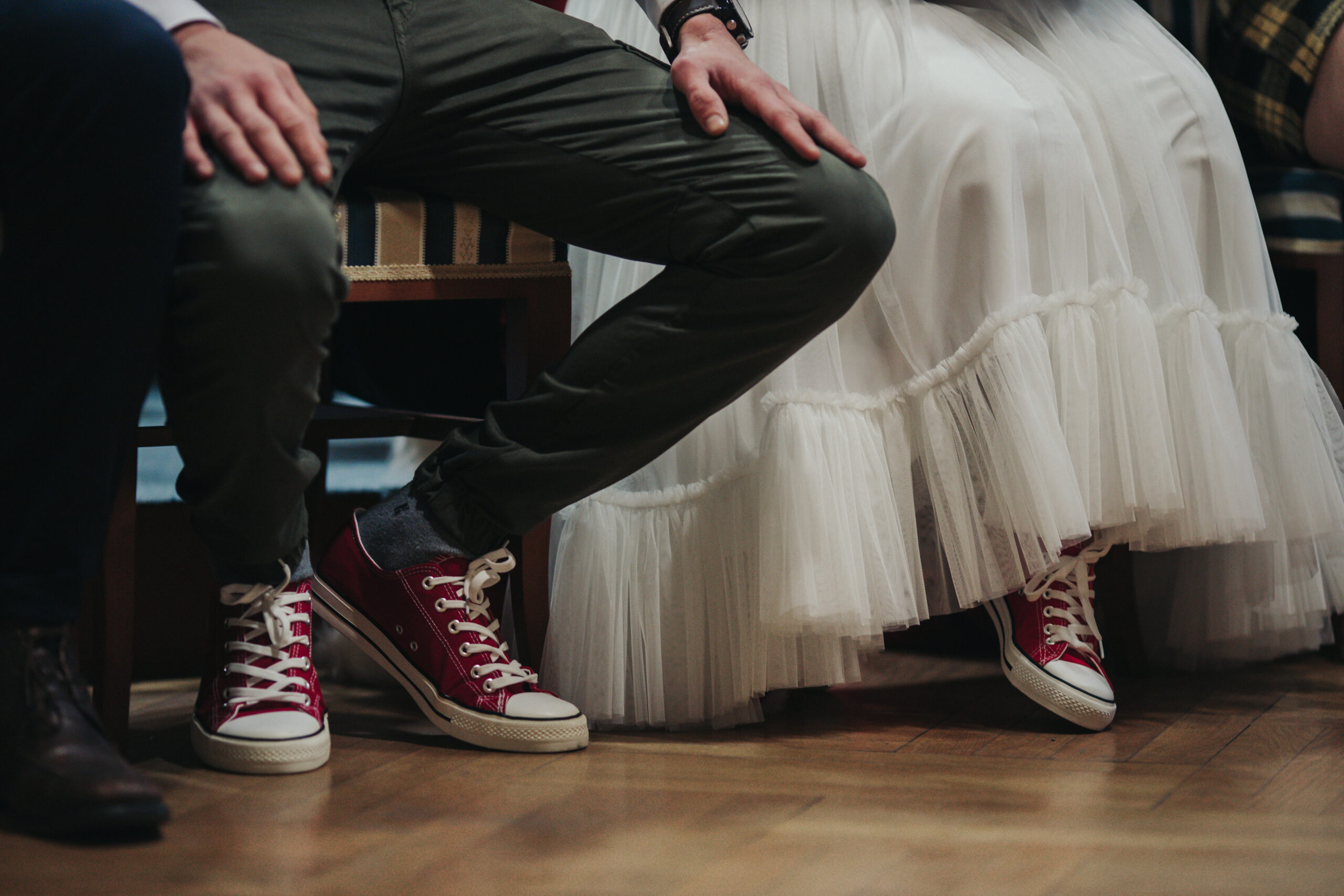 The bride and groom in their wedding shoes